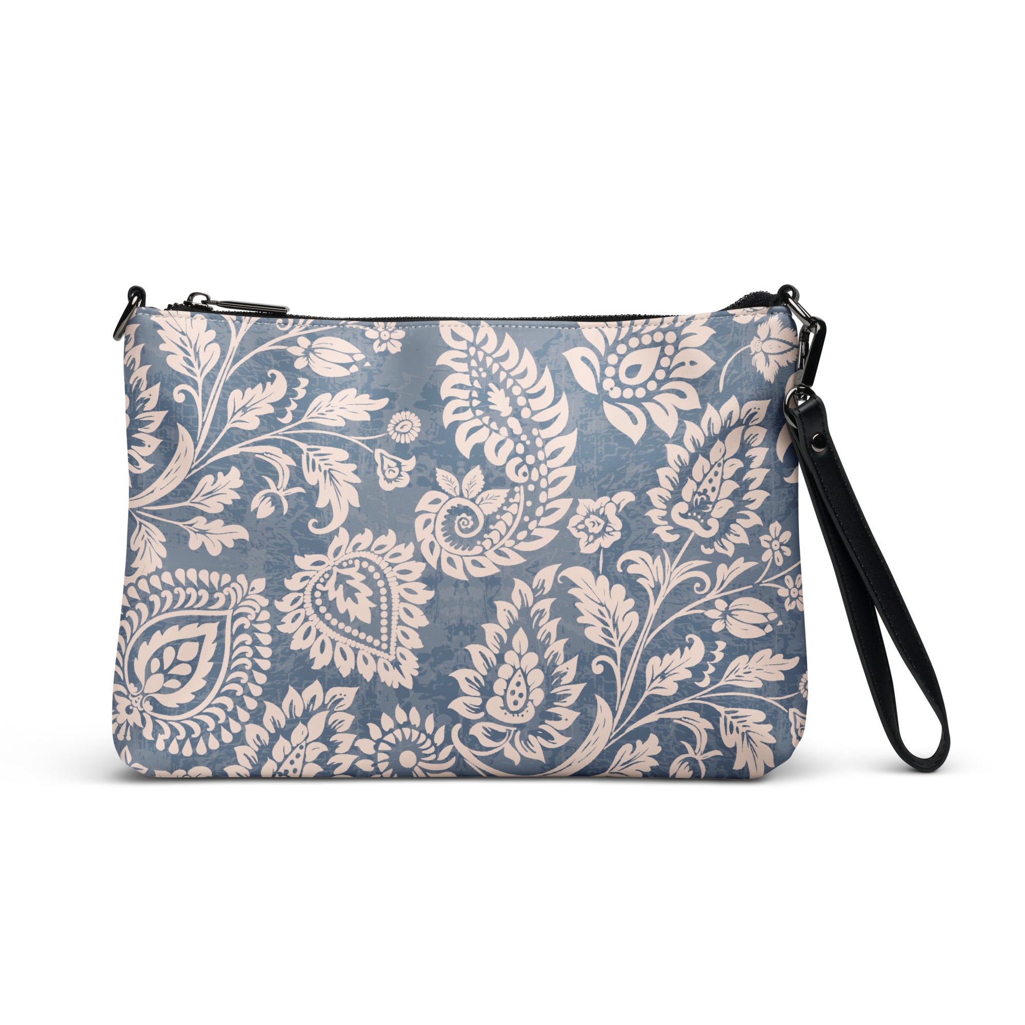 A floral patterned faux leather crossbody bag with a black strap and silver hardware, displayed against a white background.