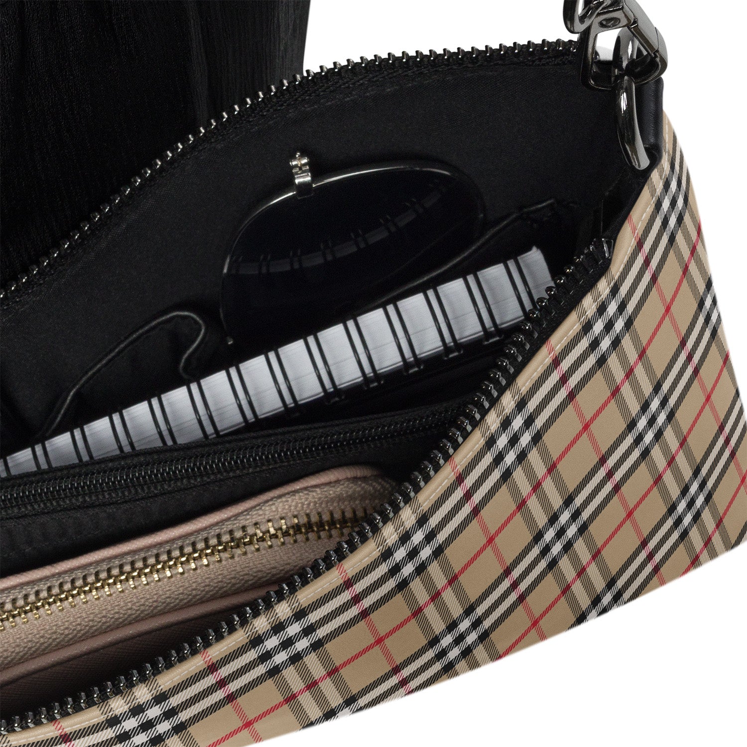 Close-up of a handbag with a checkered pattern and visible brand logo.