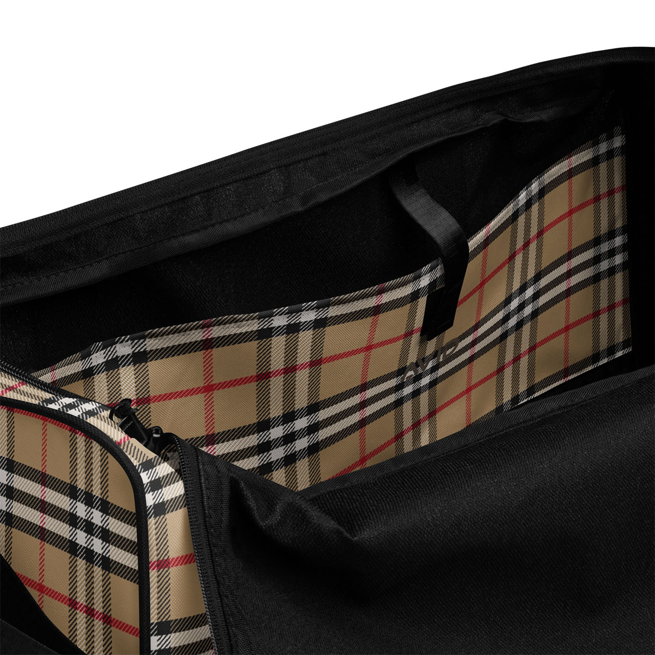 Close-up of a black bag with plaid lining on a white background