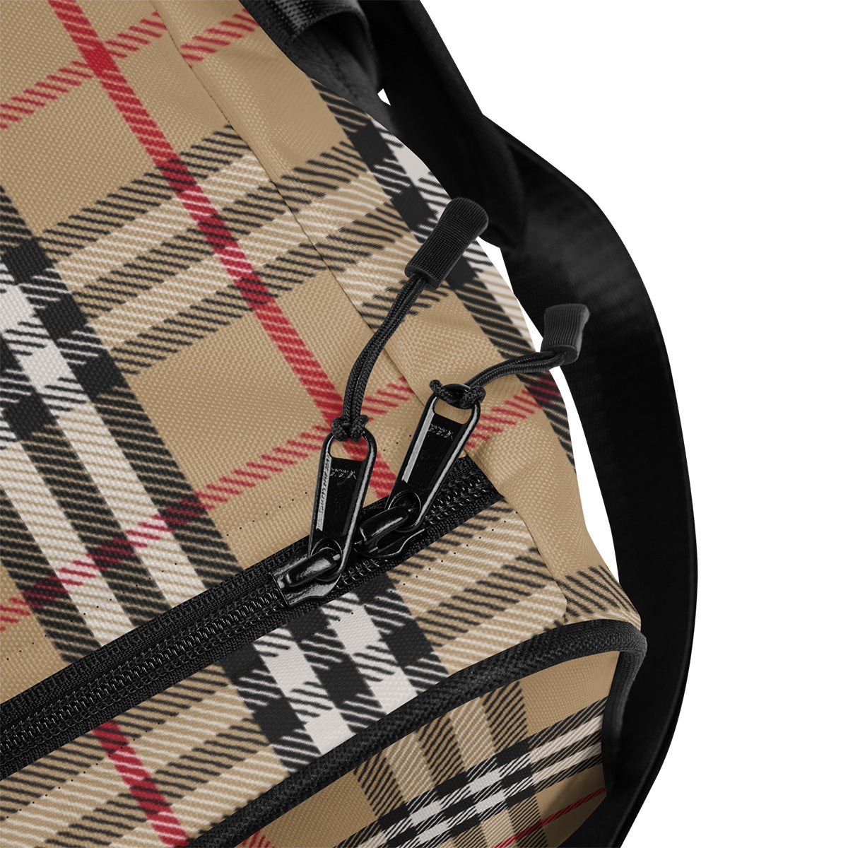 Close-up of a plaid patterned bag with black zipper and strap.