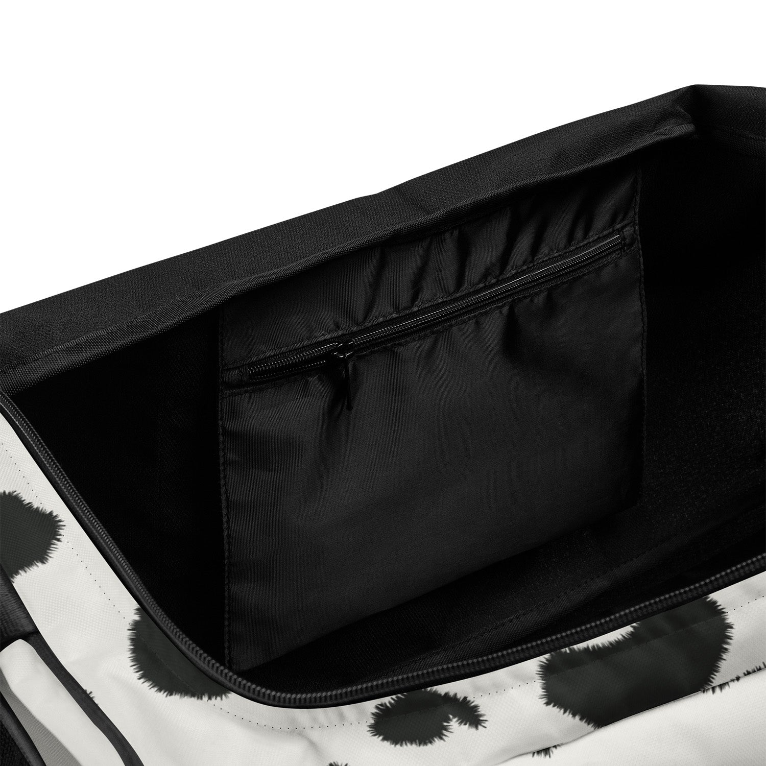 Black and white patterned suitcase with open compartment showing black interior.