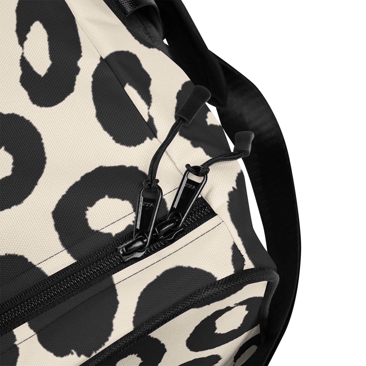 Close-up of a bag with black leopard print pattern on a beige background