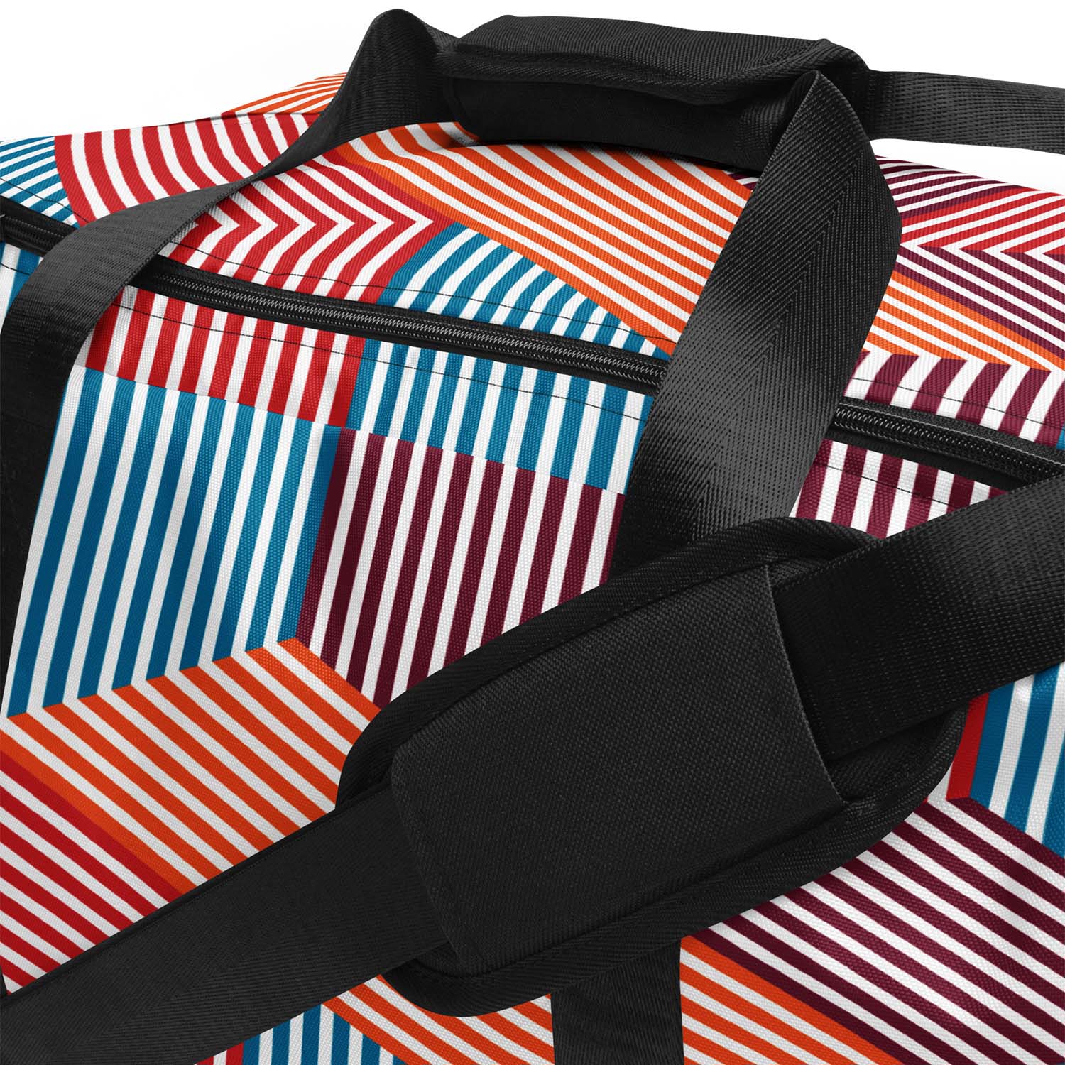 Colorful geometric patterned duffel bag with black straps on a white background