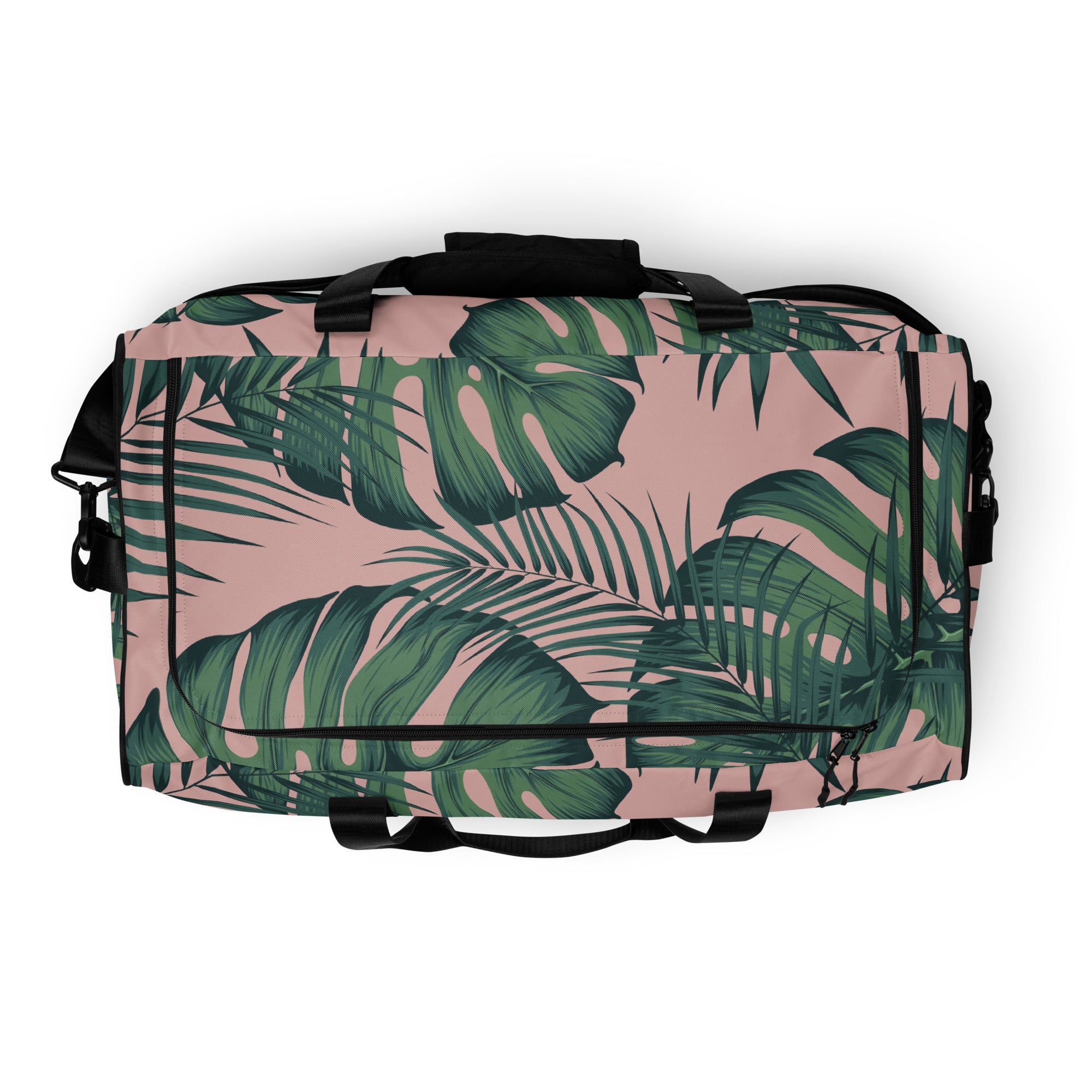 Duffle bag with tropical leaf pattern and black straps
