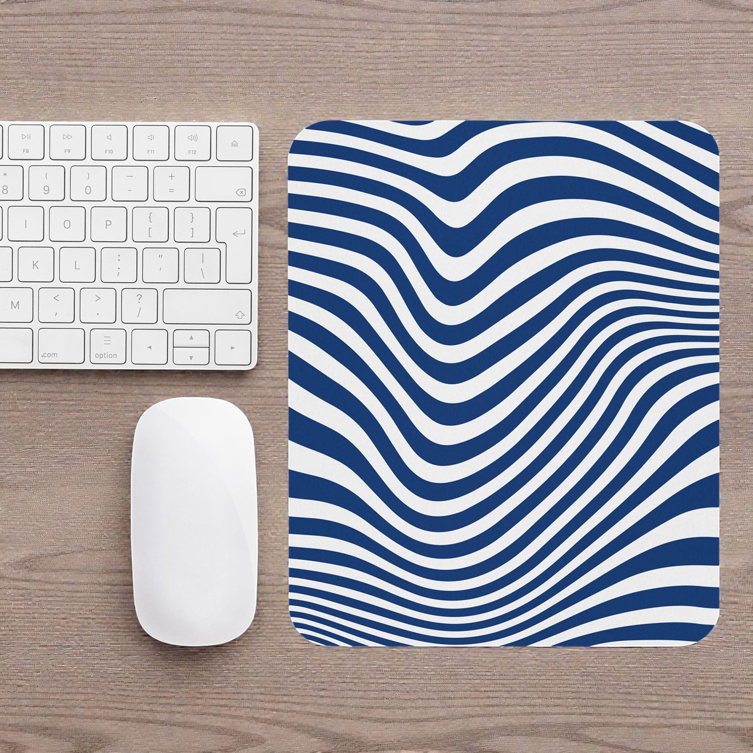 Blue Wave mouse pad on a wooden desk with a keyboard and mouse.