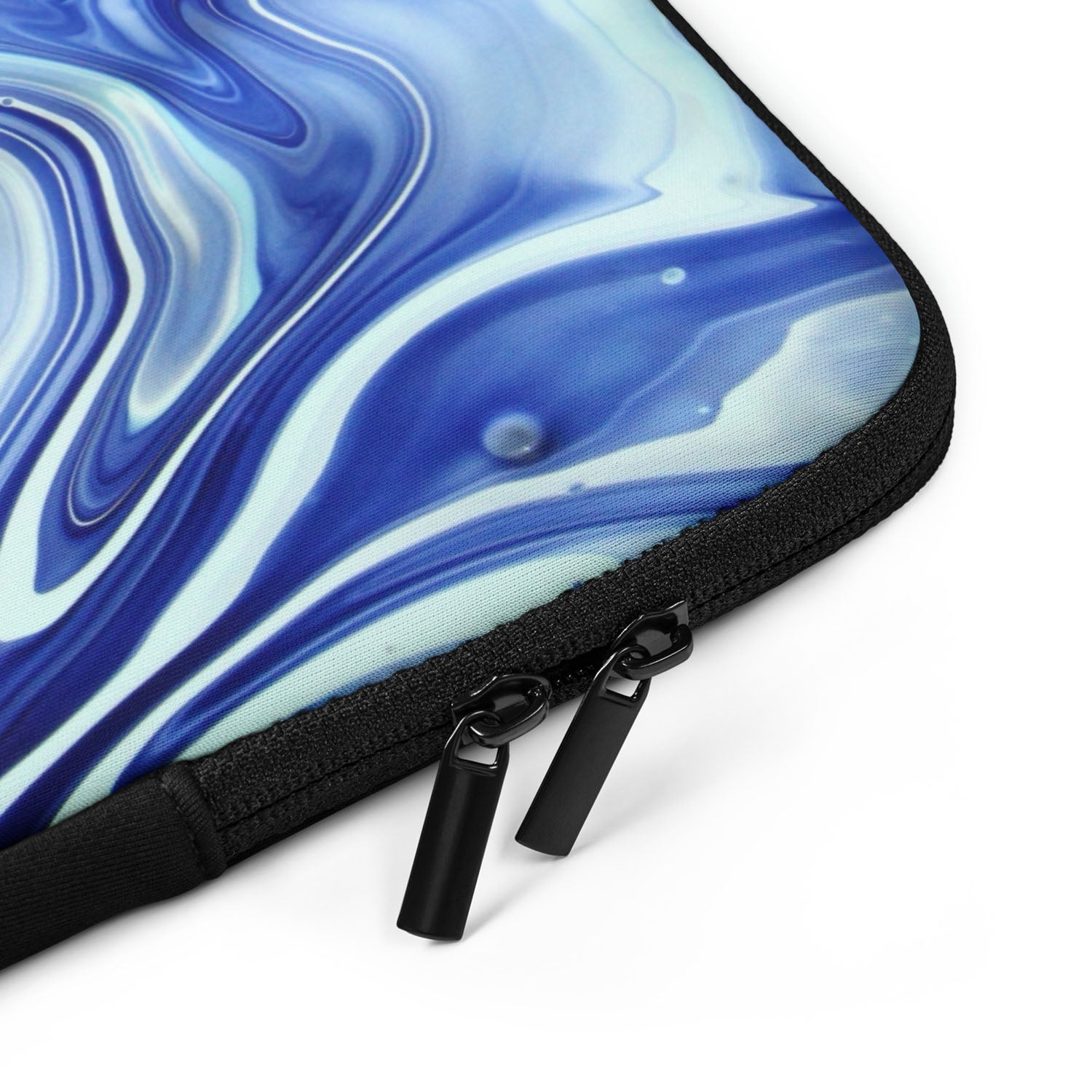 Marbled blue and white laptop sleeve with a zipper on a white background