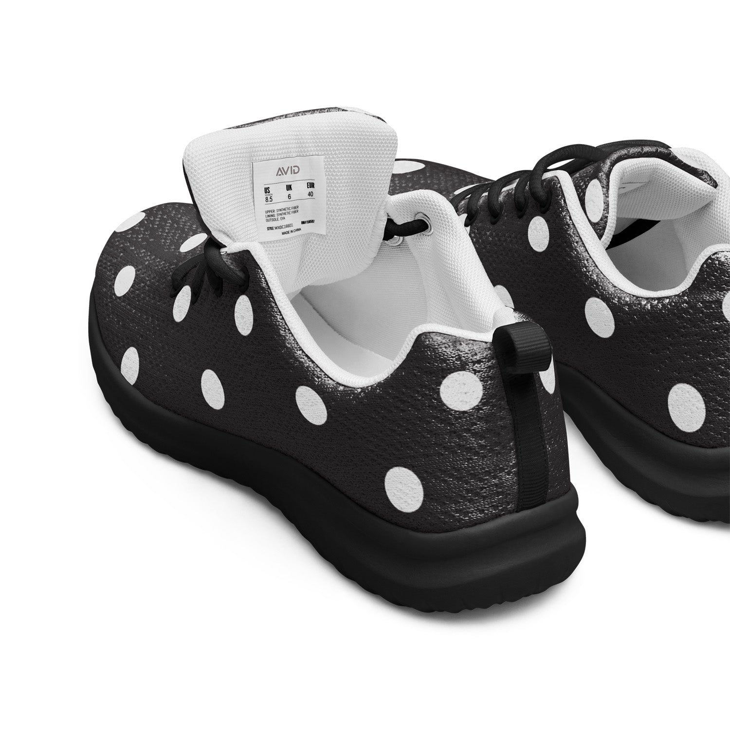 Black sneakers with white polka dots on a white background