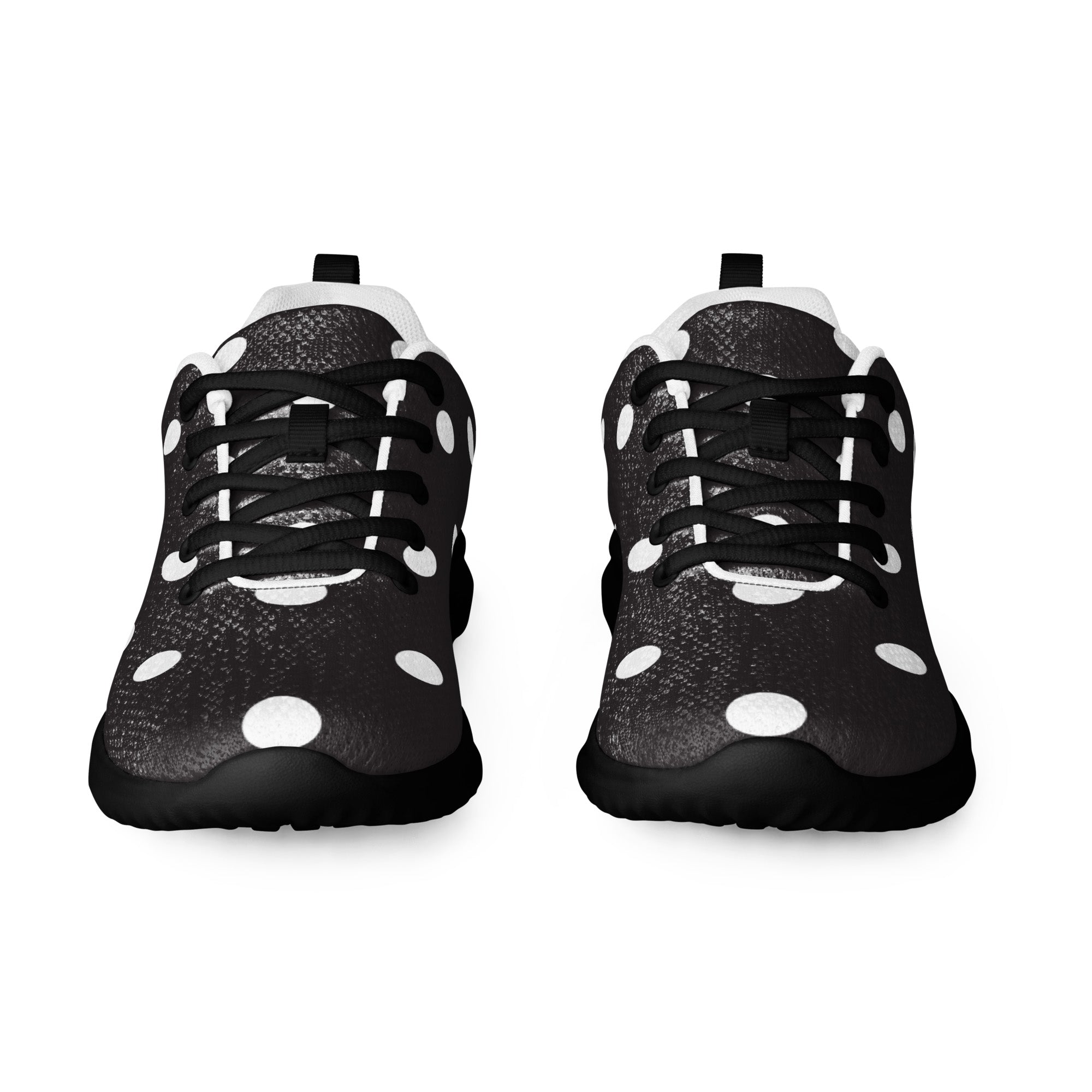 Black sneakers with white polka dots on a white background