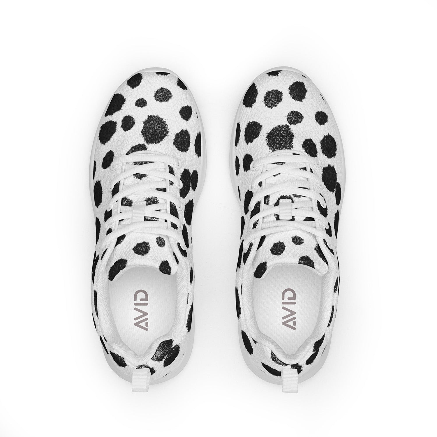 White sneakers with black polka dot pattern on a white background
