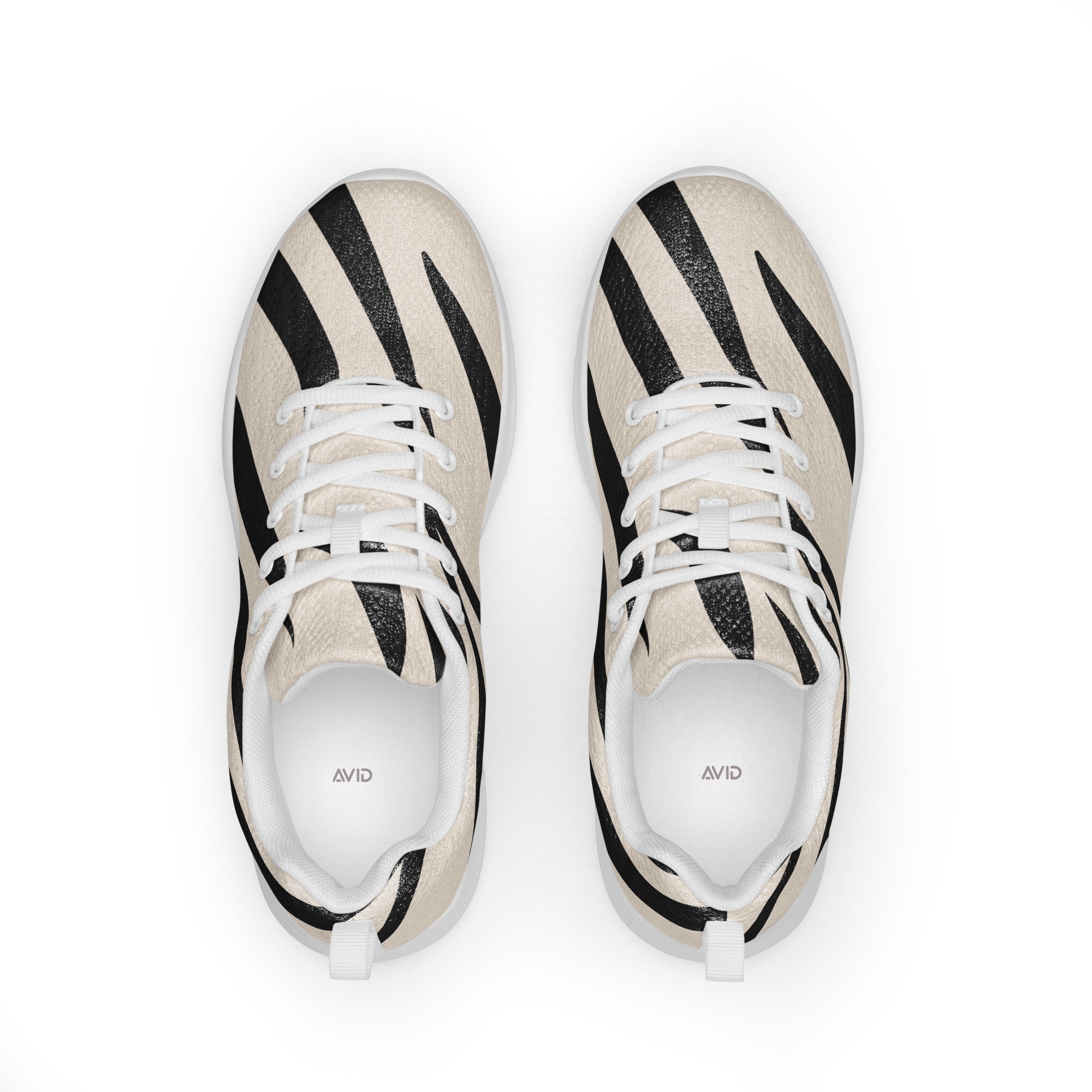 Pair of black and white striped sneakers on a white background