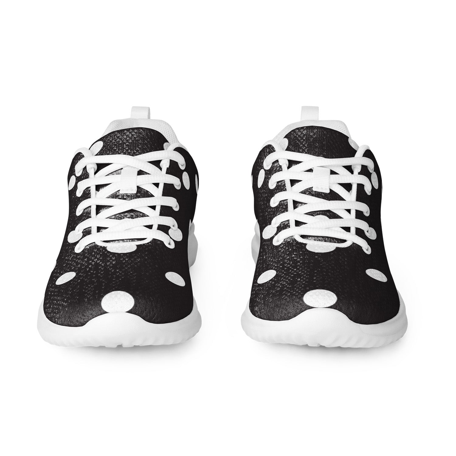 Black and white sneakers with polka dot pattern on a white background
