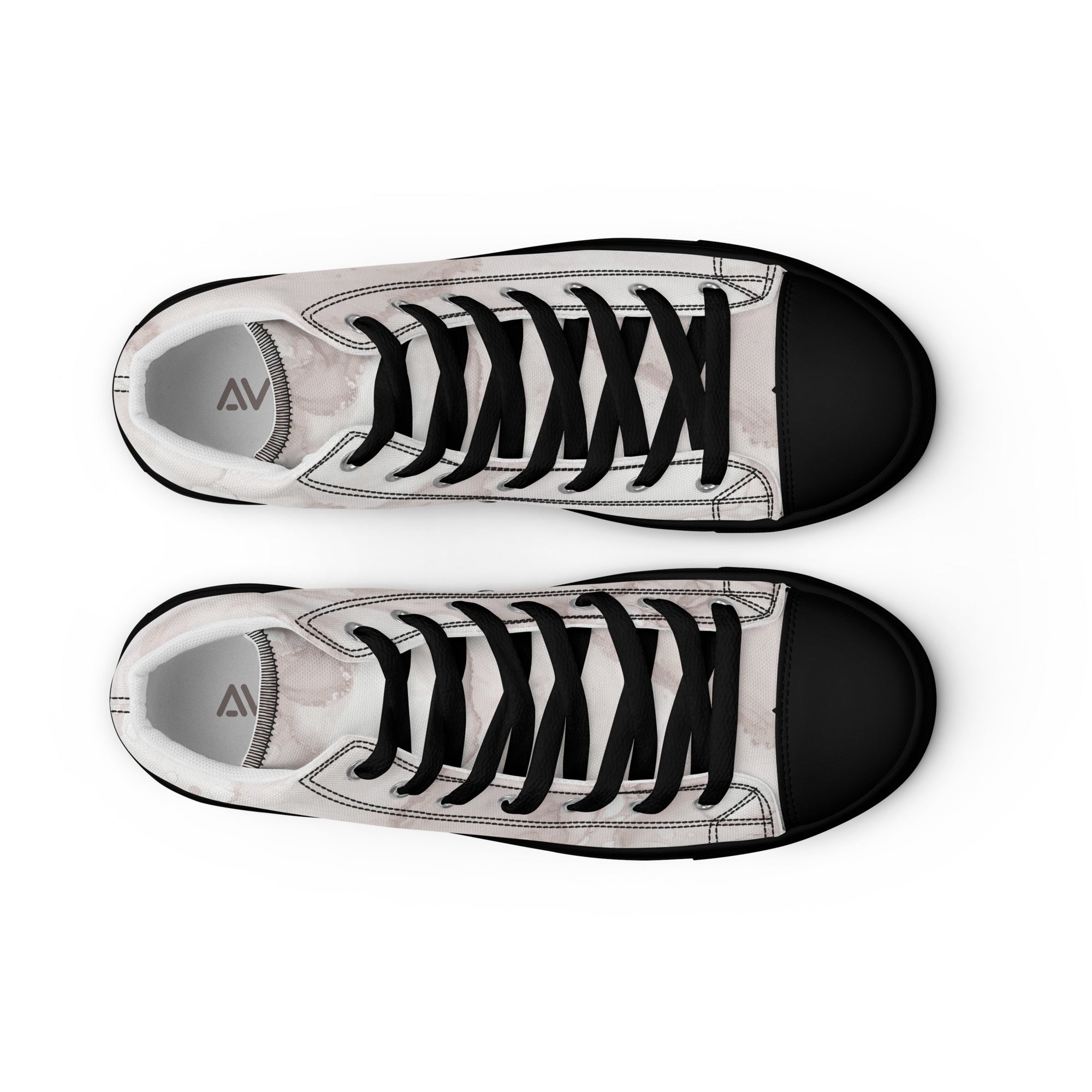 Pair of black and white sneakers with a visible brand logo on a white background