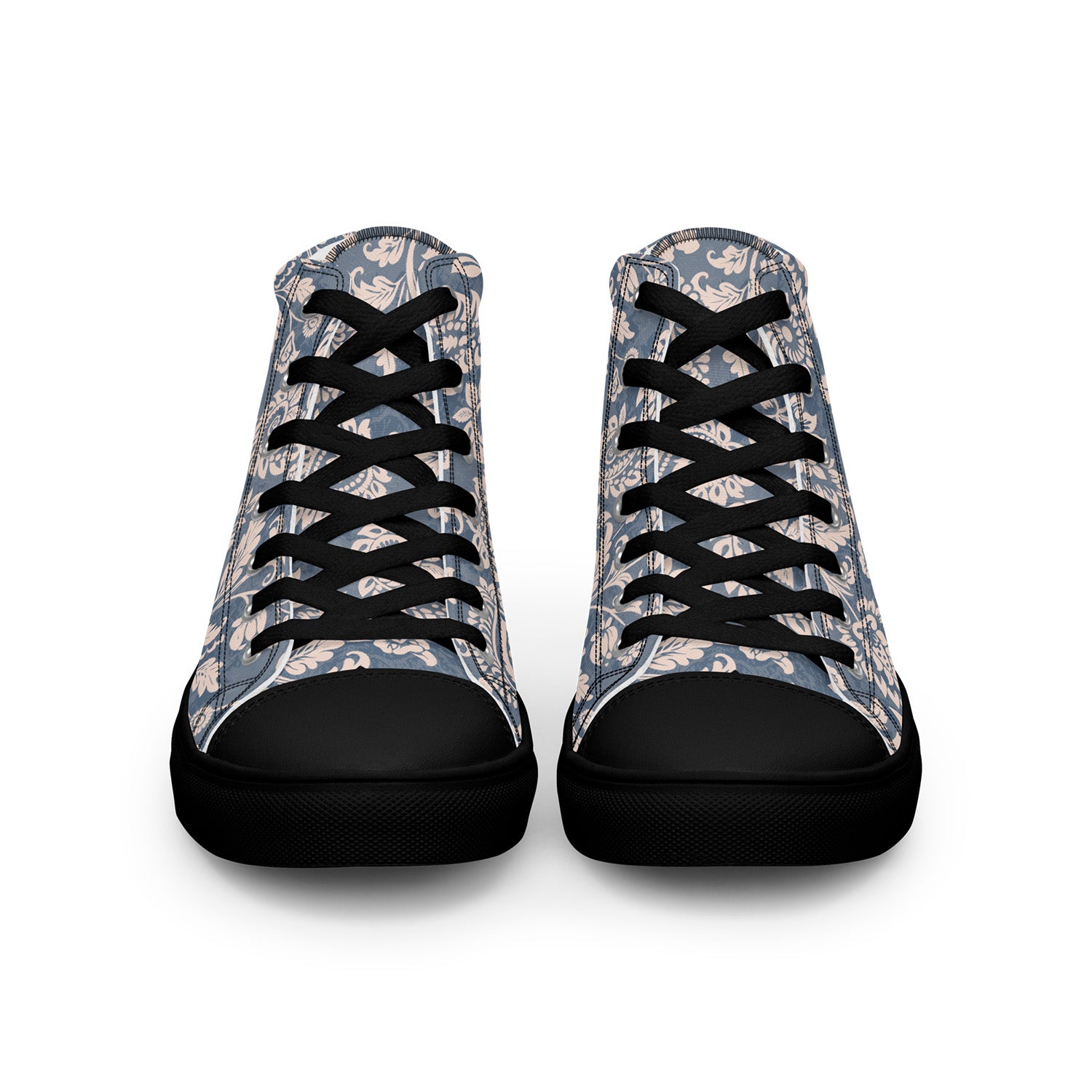 Pair of high-top sneakers with camouflage pattern and black laces on a white background