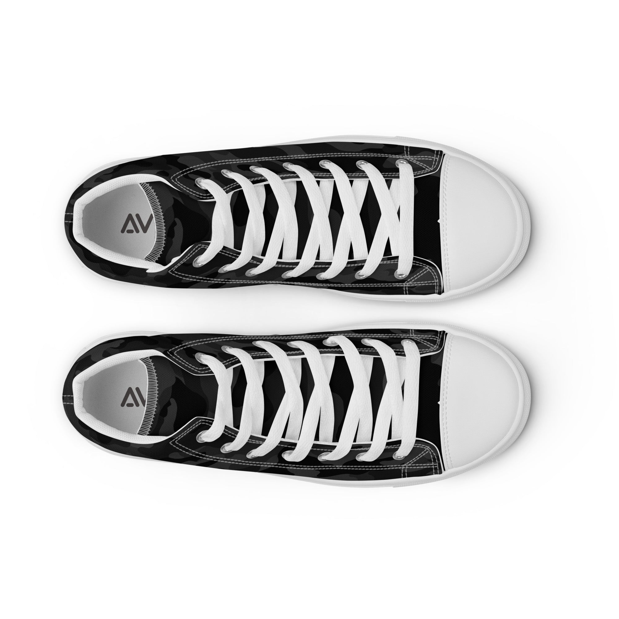 Black and white sneakers with a brand logo on a white background