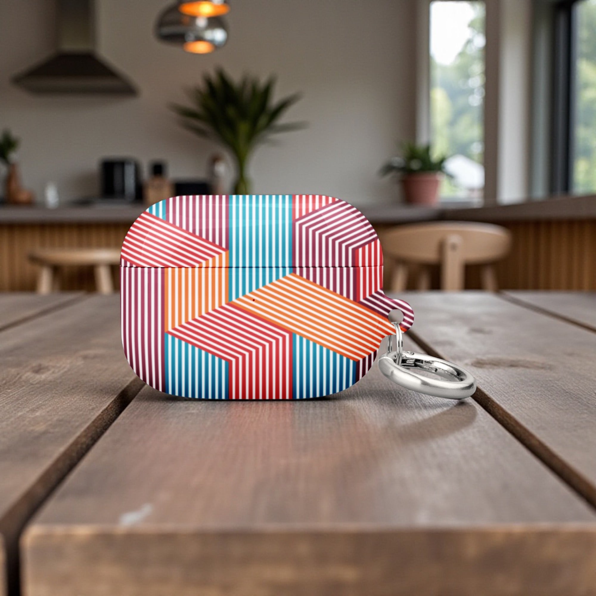 Colorful geometric patterned case on a wooden table with a blurred kitchen background