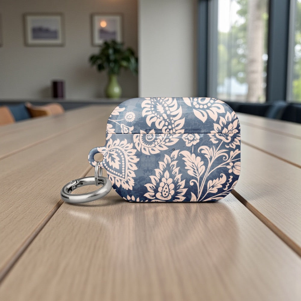 Blue and white patterned case on a wooden surface with a blurred indoor background