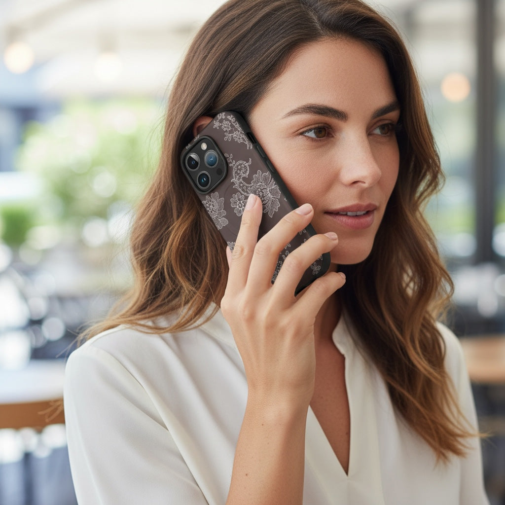 Woman talking on an iphone with an Auburn magsafe case