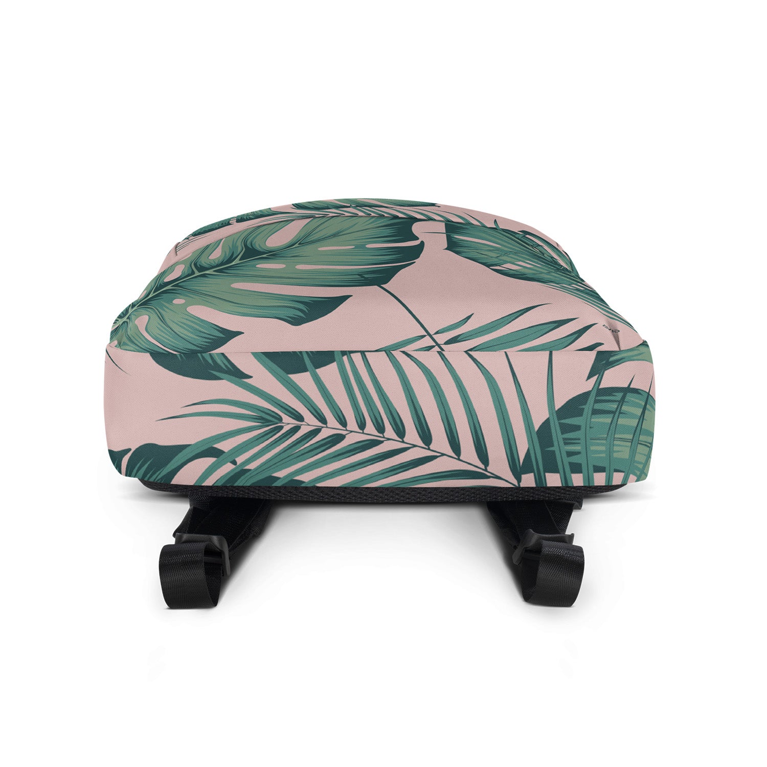 Small suitcase with tropical leaf pattern on a white background