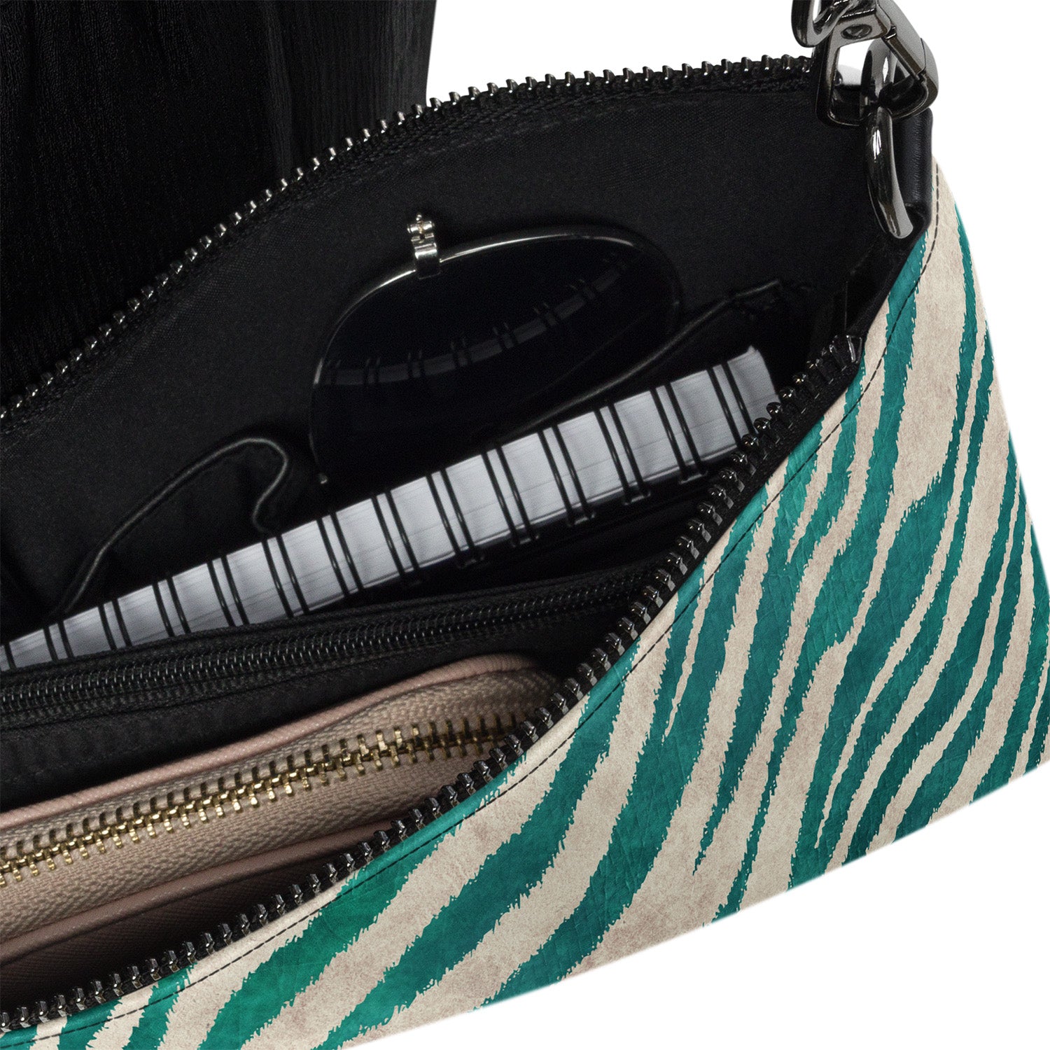 Close-up of a zebra-striped handbag with a visible brand logo.