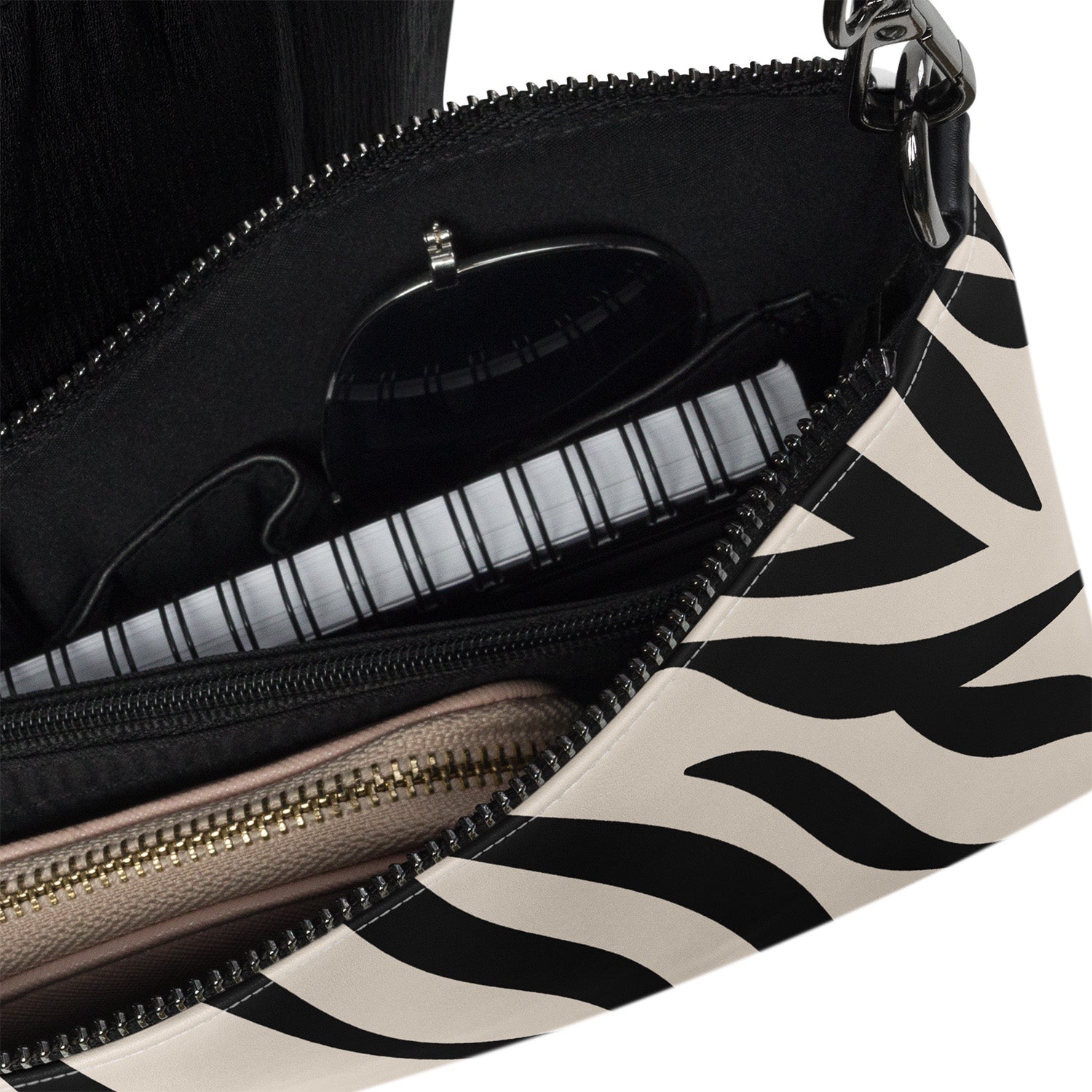 Close-up of a handbag with zebra pattern and black interior