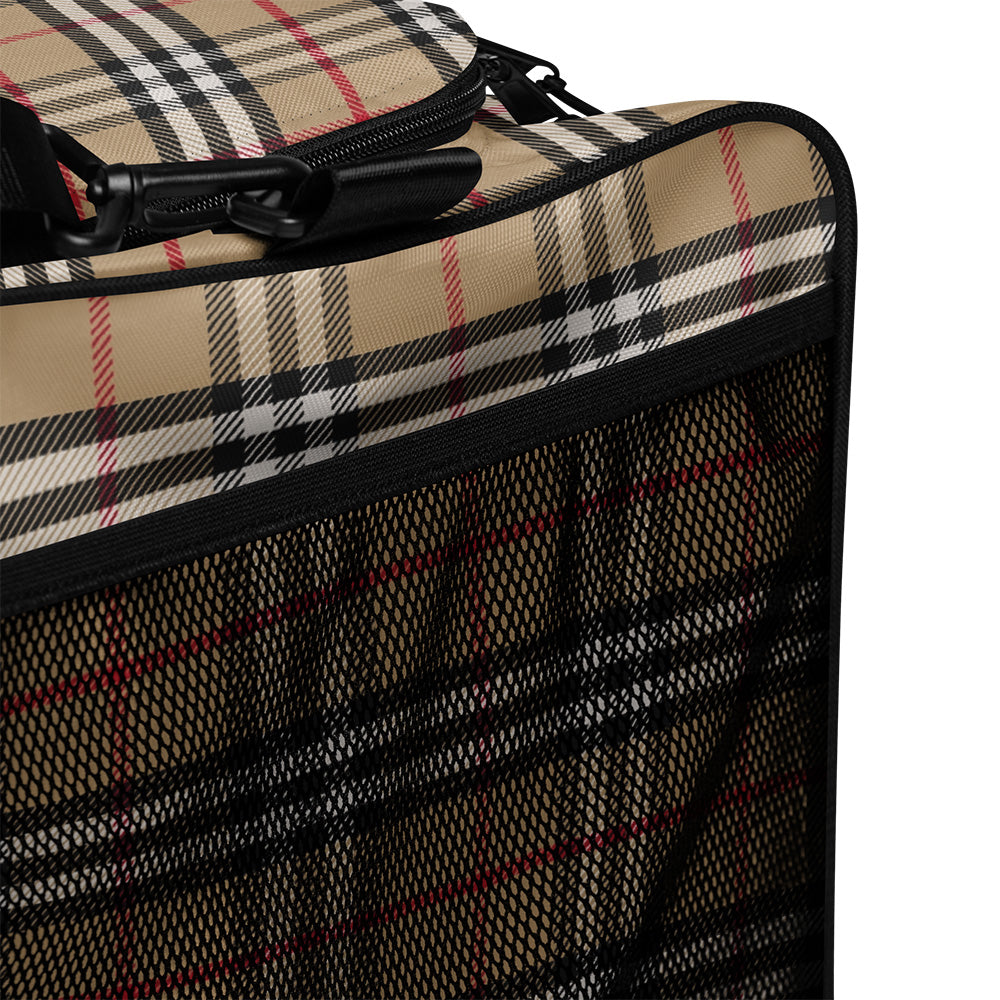 Close-up of a checkered suitcase with a black zipper on a white background
