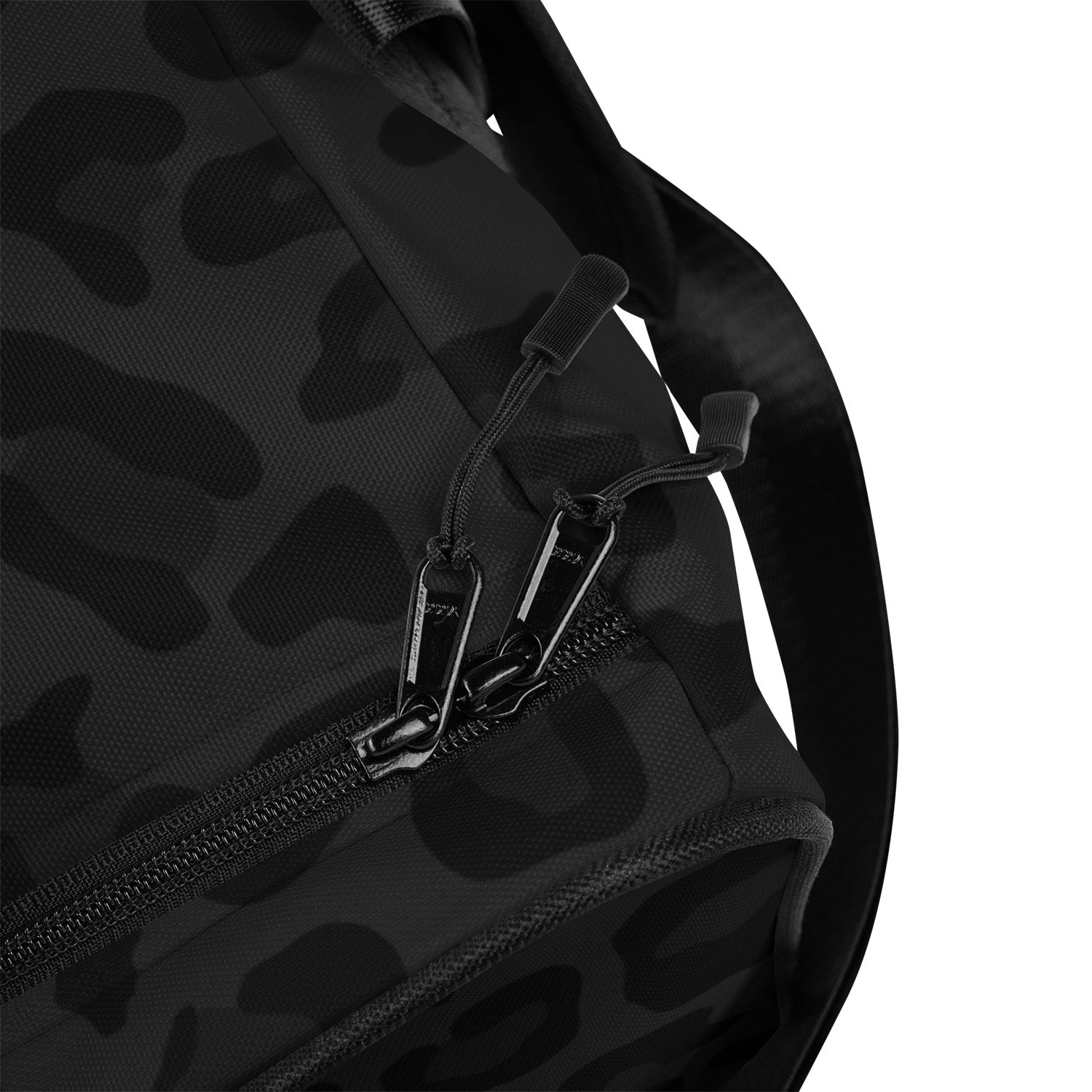 Black camouflage backpack with zipper details on a white background