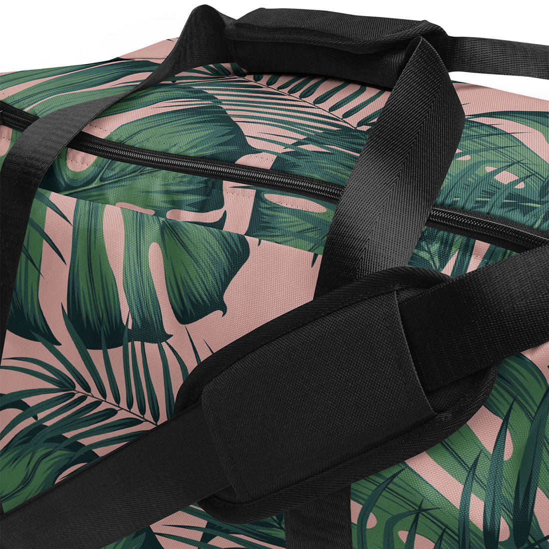 Duffle bag with tropical leaf pattern and black straps