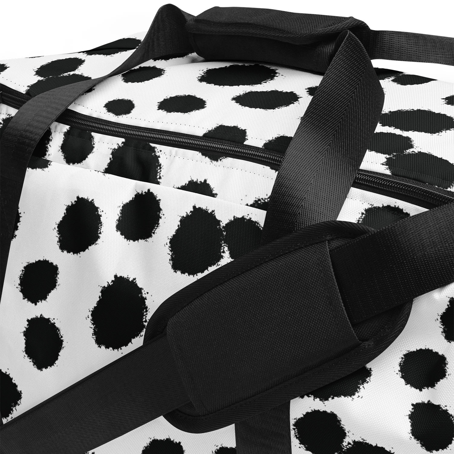 Duffle bag with black and white polka dot pattern