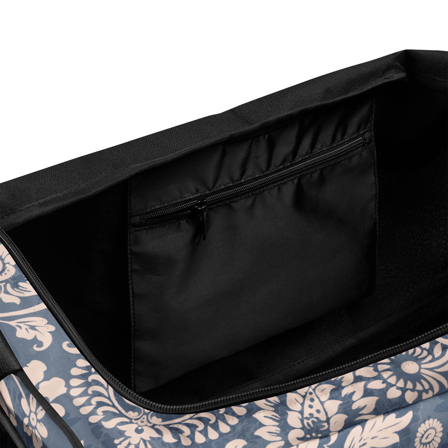 Floral-patterned bag with a black interior pocket on a white background
