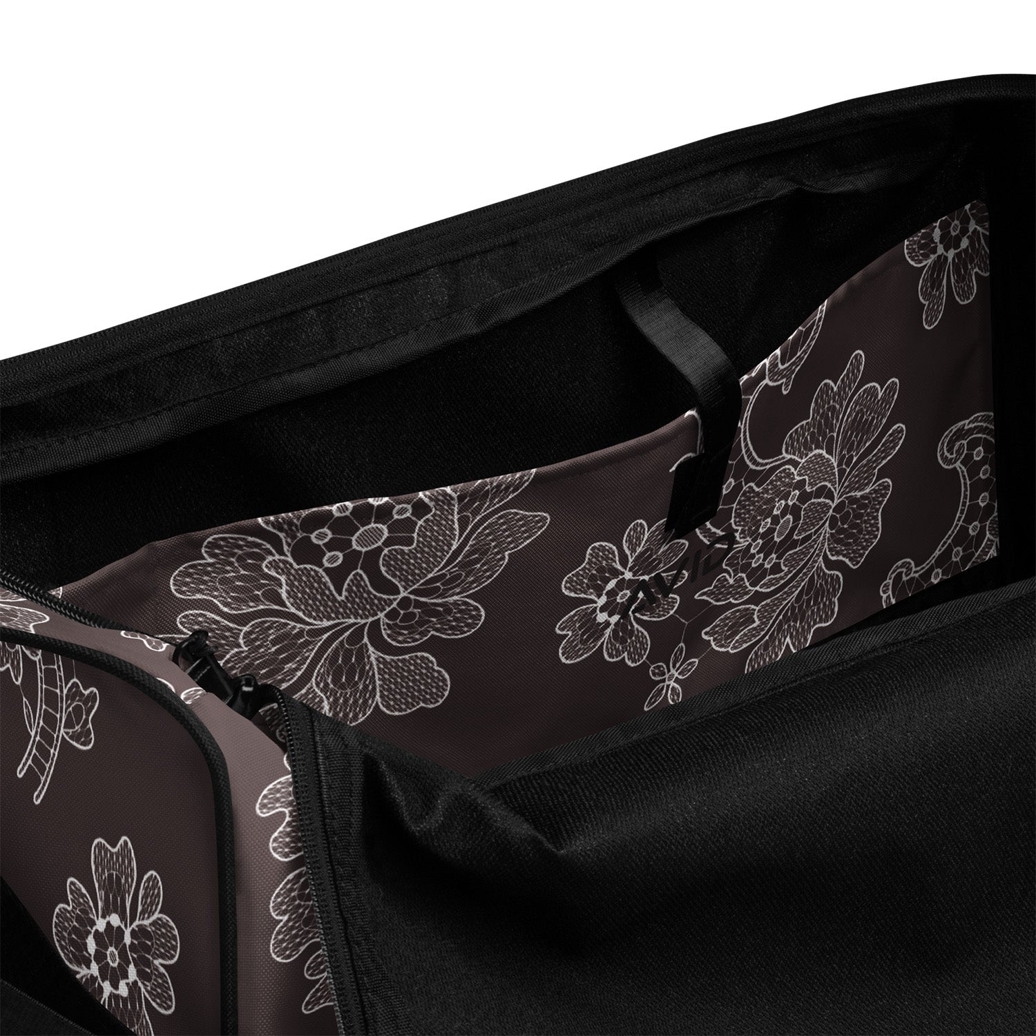 Black bag with white floral patterns on a white background