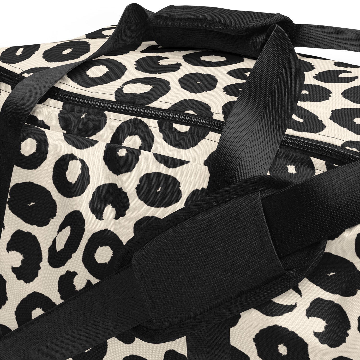 Leopard print duffel bag with black straps on a white background