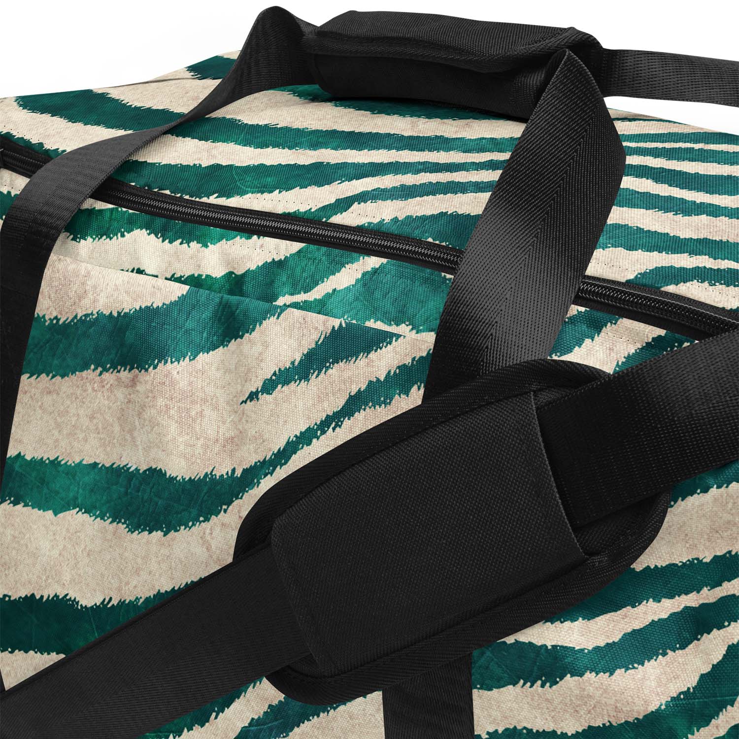 Duffel bag with green and beige pattern and black straps