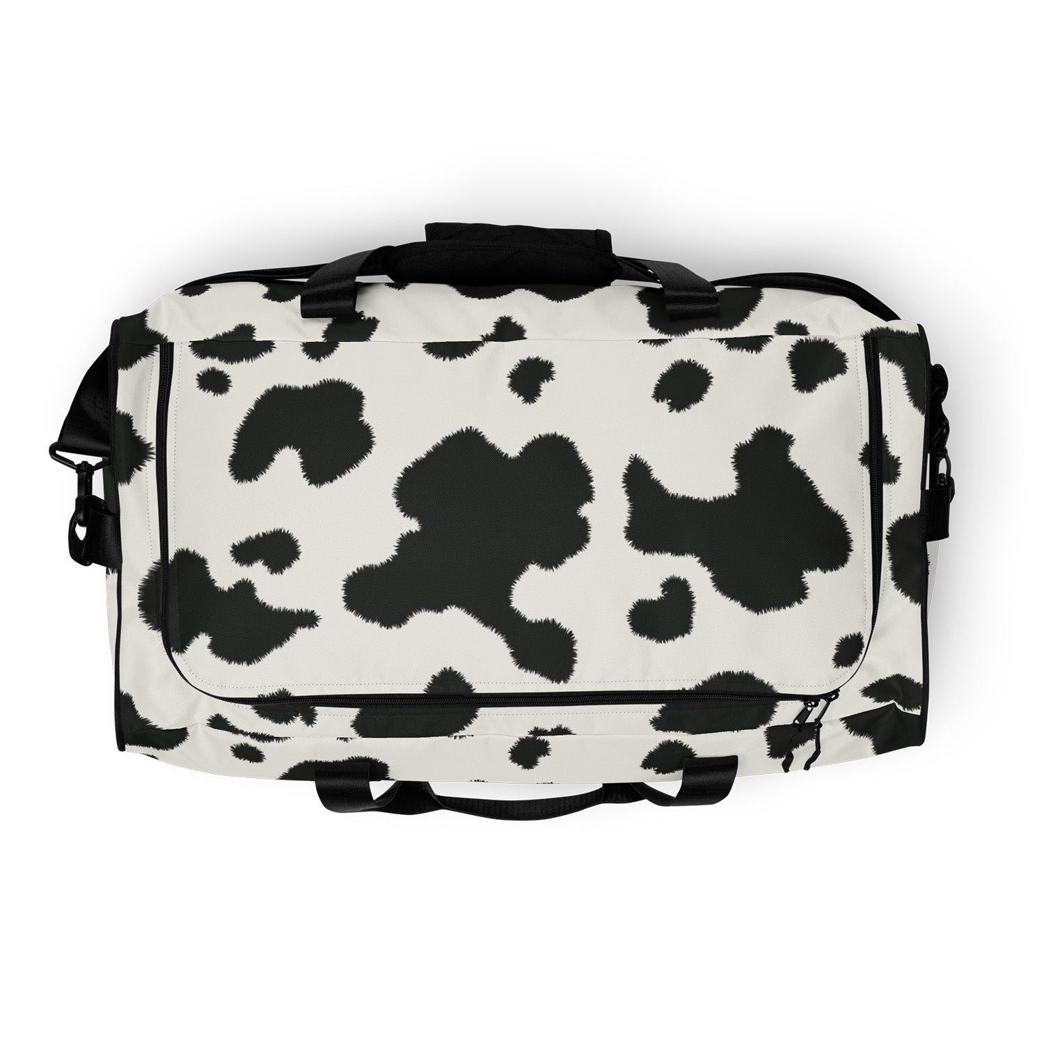 Duffel bag with black and white cow print pattern on a white background