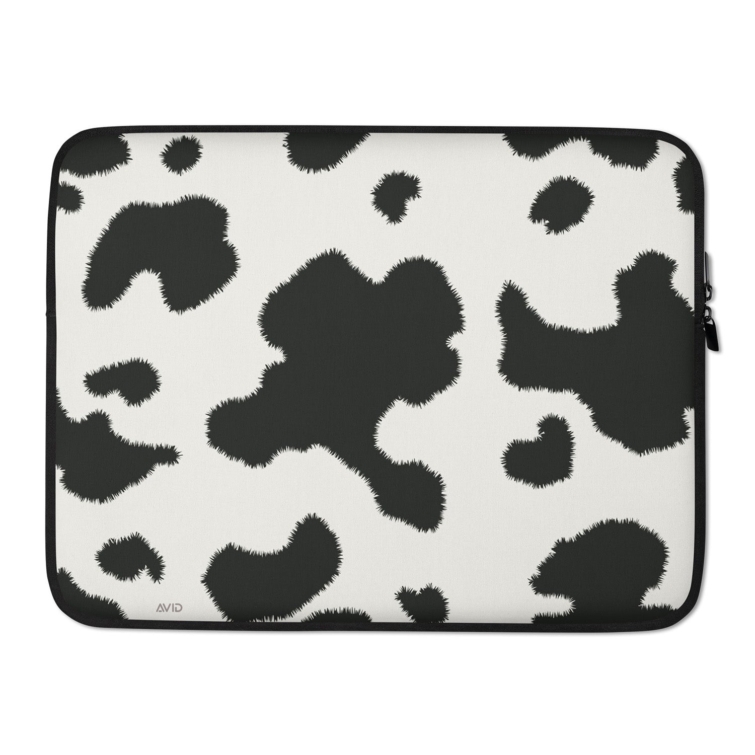 Laptop sleeve with black and white cow print pattern on a white background