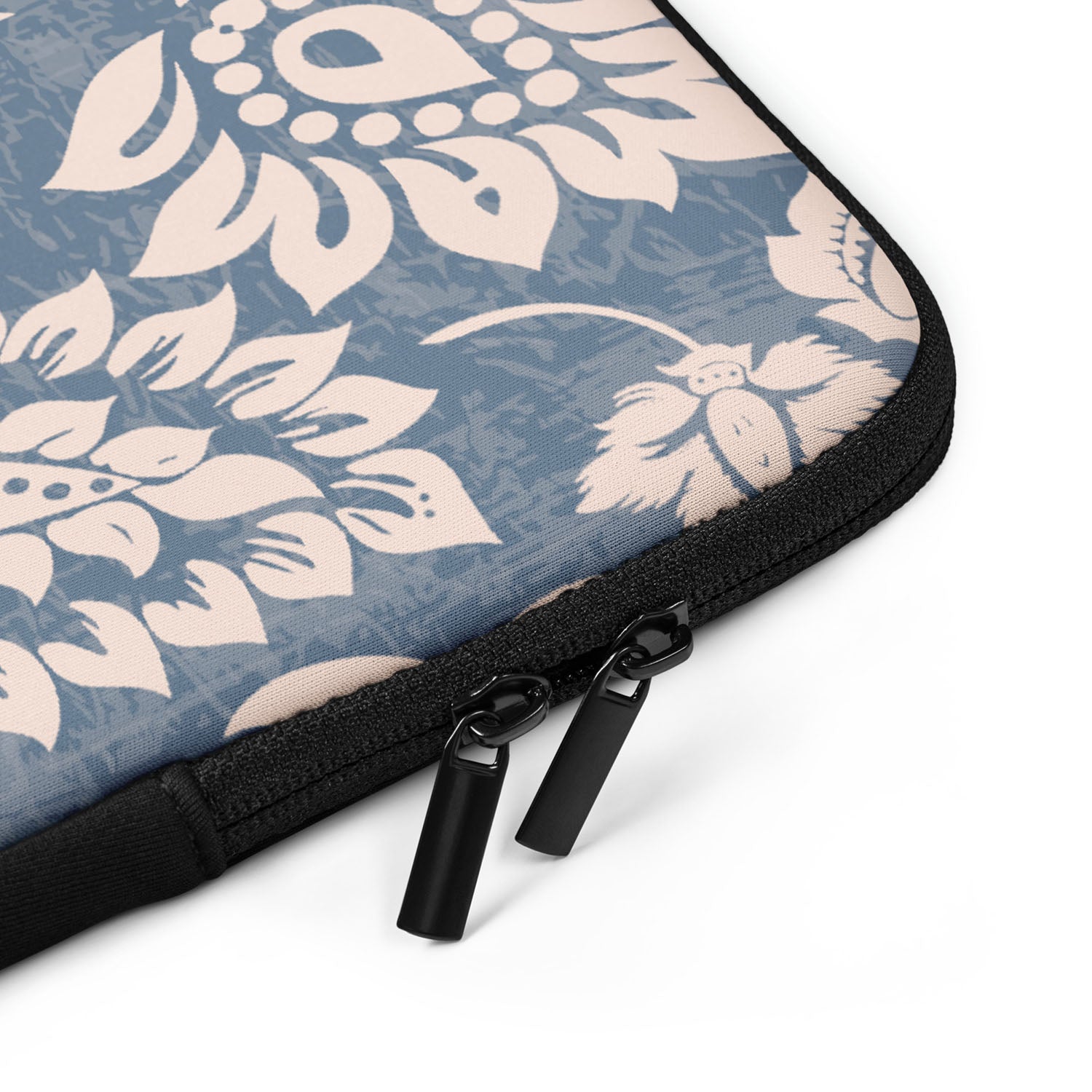 Floral patterned laptop sleeve with a zipper on a white background