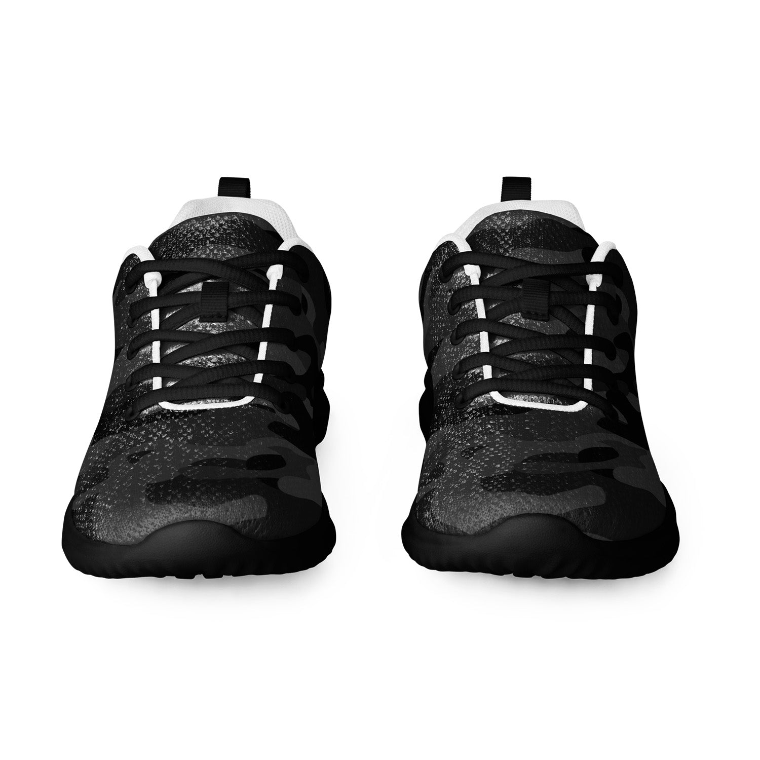 stealth black sneakers with white soles on a white background
