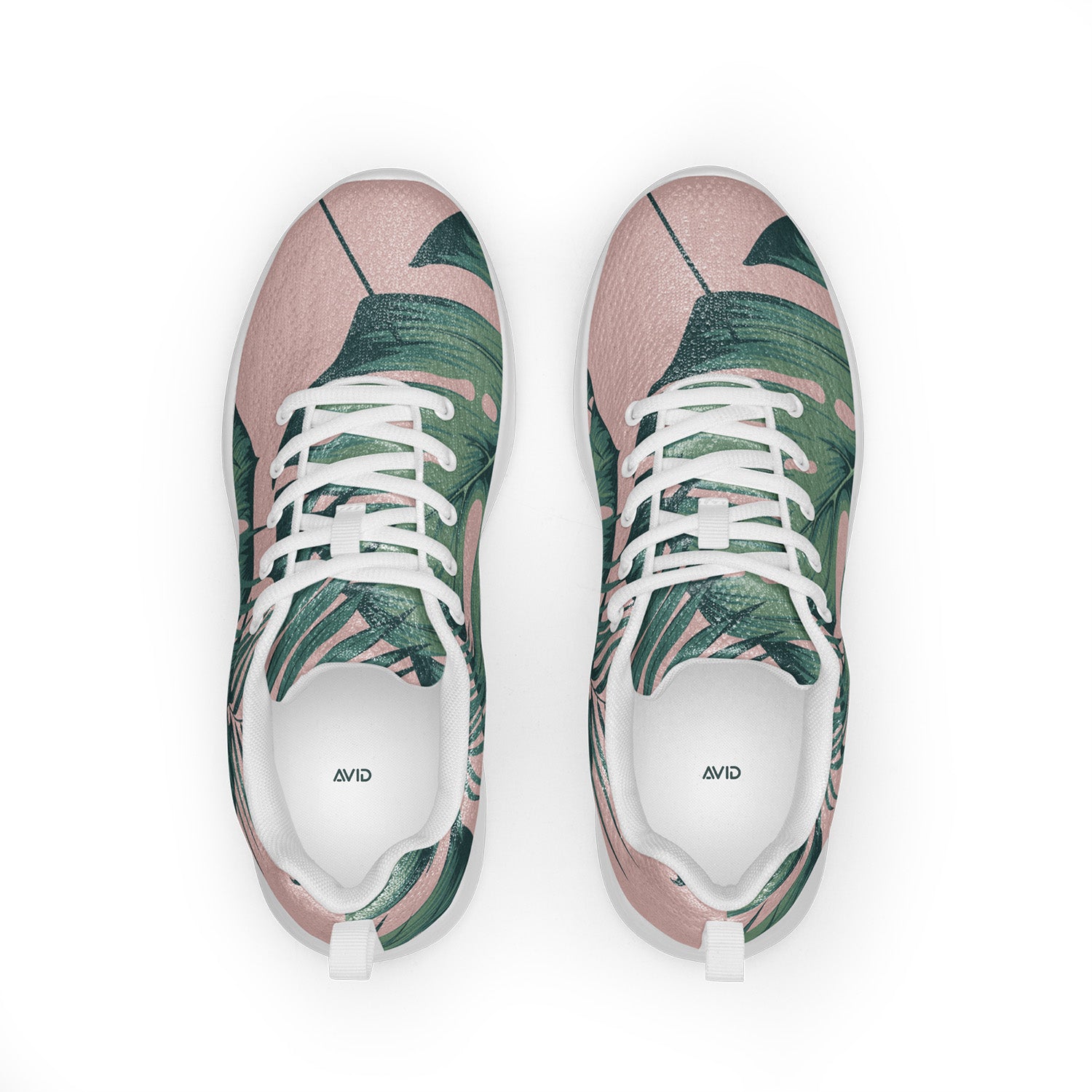 Pair of sneakers with tropical leaf pattern on a white background