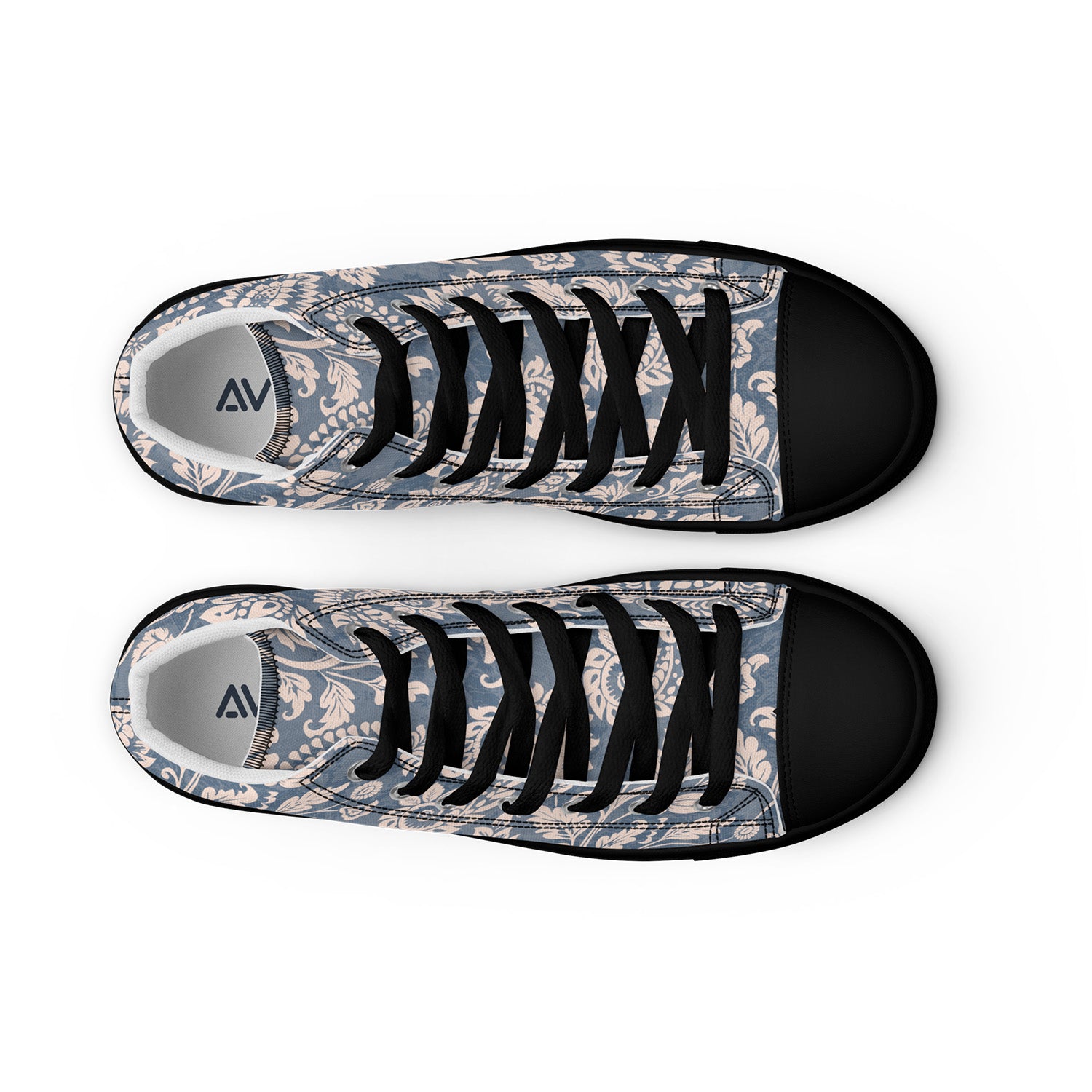 Pair of sneakers with floral pattern and black laces on a white background