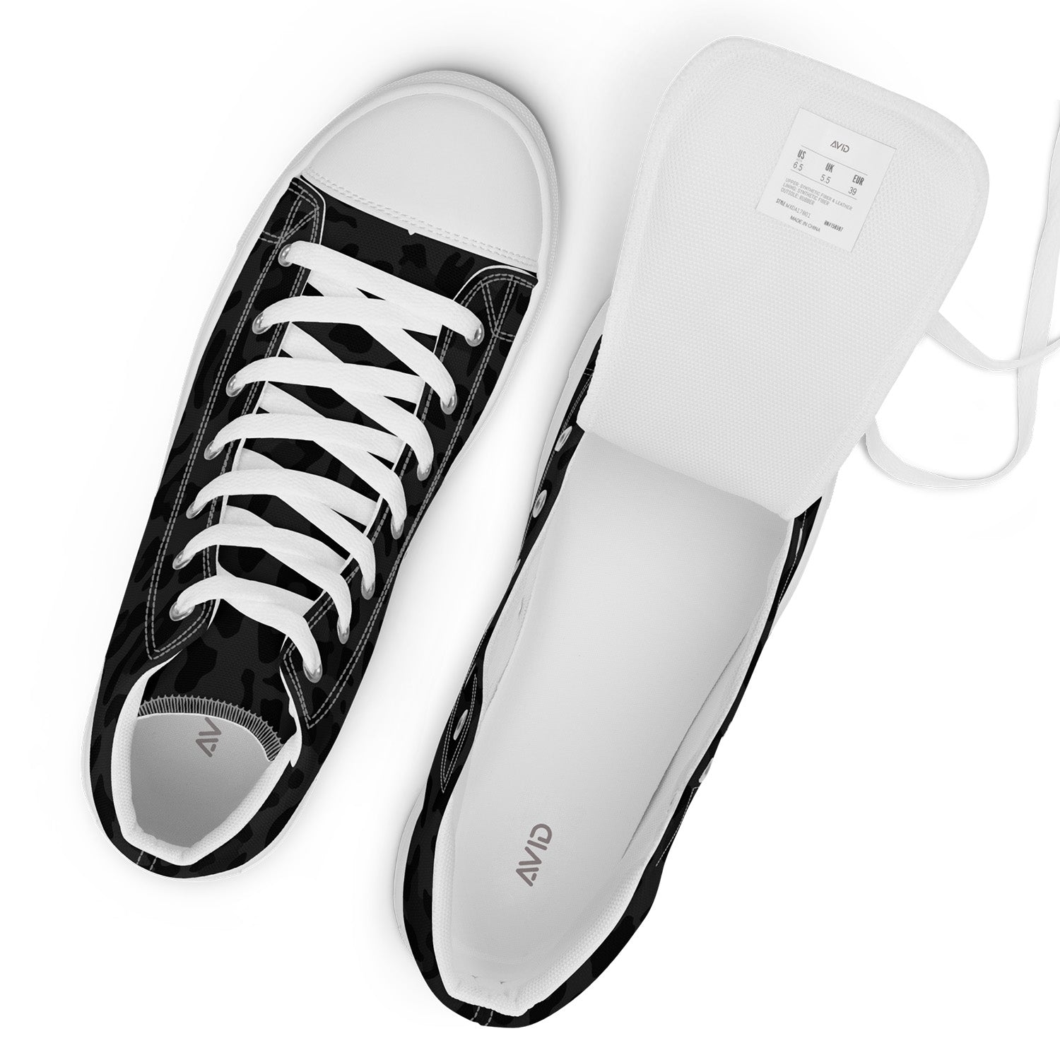 Black and white sneakers with a visible brand logo on a white background