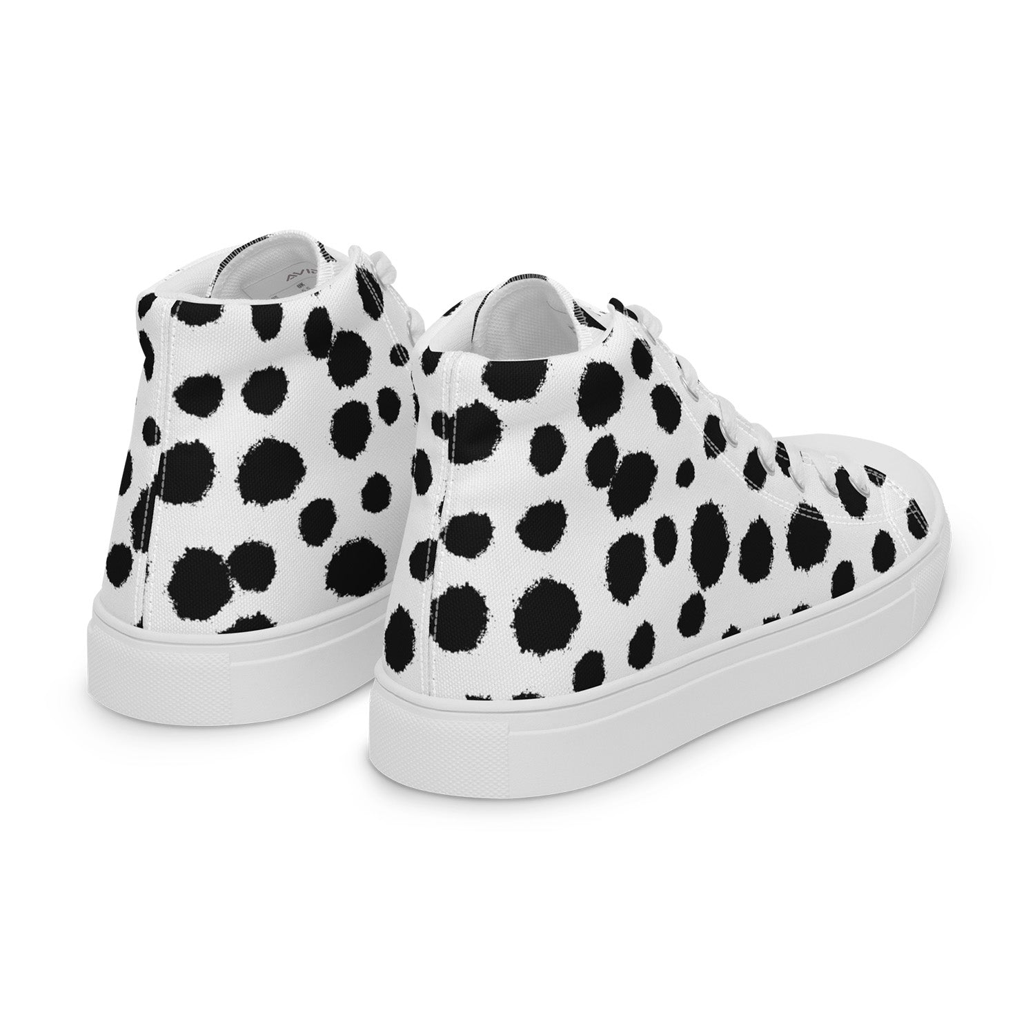 White sneakers with black polka dot pattern on a white background