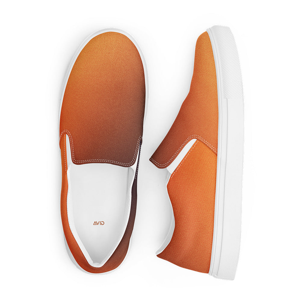 Orange and white slip-on shoes on a white background